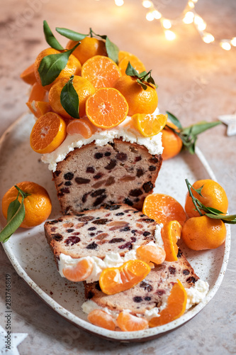 Christmas fruit cake decorated with a clementines