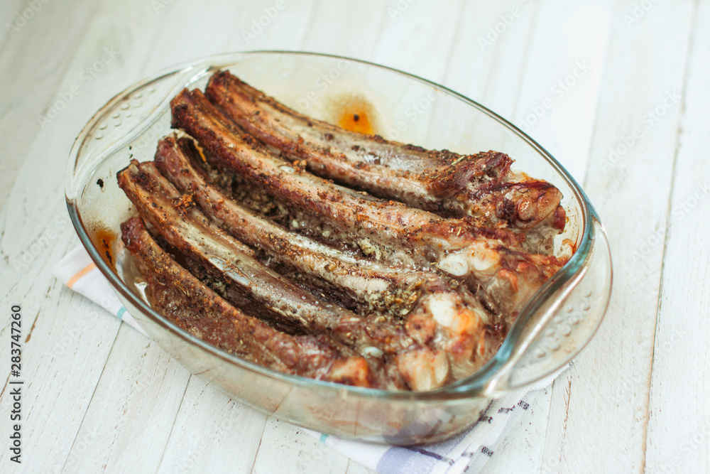 Fresh pork ribs marinated in spices. Delicious and hearty dinner.