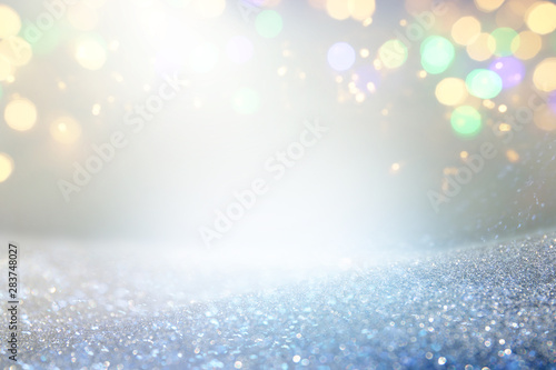 blackground of abstract glitter lights. blue, gold and silver. de focused © tomertu