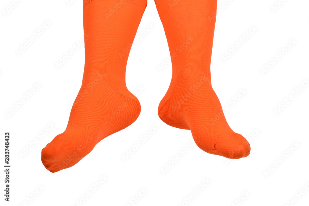 Orange socks on woman foot isolated on white background. Orange socks on woman foot isolated on white background.