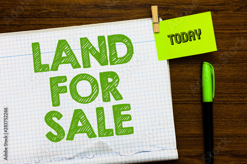 Writing note showing Land For Sale. Business photo showcasing Real Estate Lot Selling Developers Realtors Investment Open notebook page markers holding paper heart wooden background