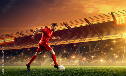 Soccer player in action with a ball duting soccer game © TandemBranding