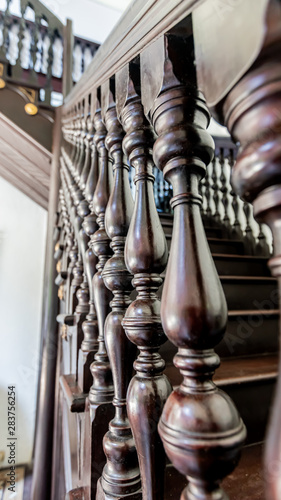 the wooden reiling of a wooden staircase photo