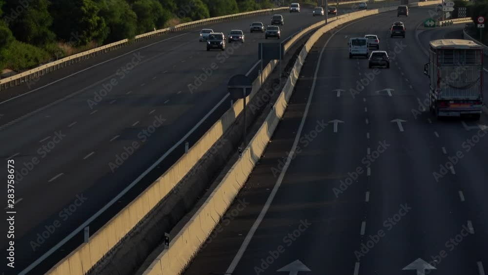 4K. Ultra HD. Aerial view of vehicles traveling the road under the afternoon light. Safe driving on the road. Engravings in the round trip. Holidays. 4K. Ultra HD. Aerial view of vehicles traveling the road under the afternoon light. Safe driving on the road. Engravings in the round trip. Holidays.