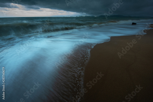 The chaos sea wave during storm forming on the beach of tropical ocean