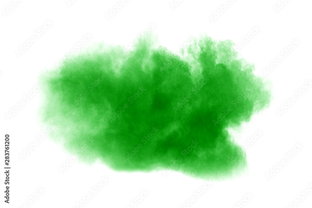 Green dust particles explosion on white background. Color powder dust