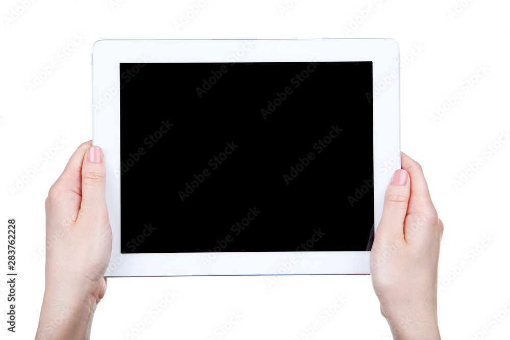 Tablet computer in female hands isolated on white background Tablet computer in female hands isolated on white background
