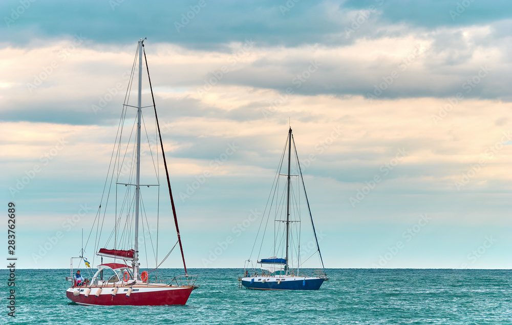 Two yachts and blue water ocean