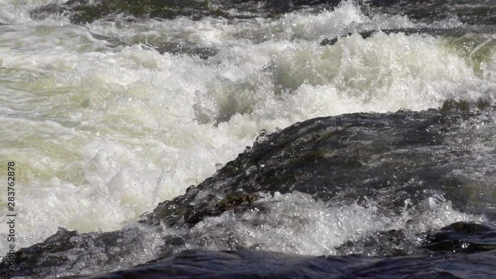 Slow Motion shot of the powerful rapids in the Zambezi River right above Victoria Falls. Shot from the Zambia side of the river.