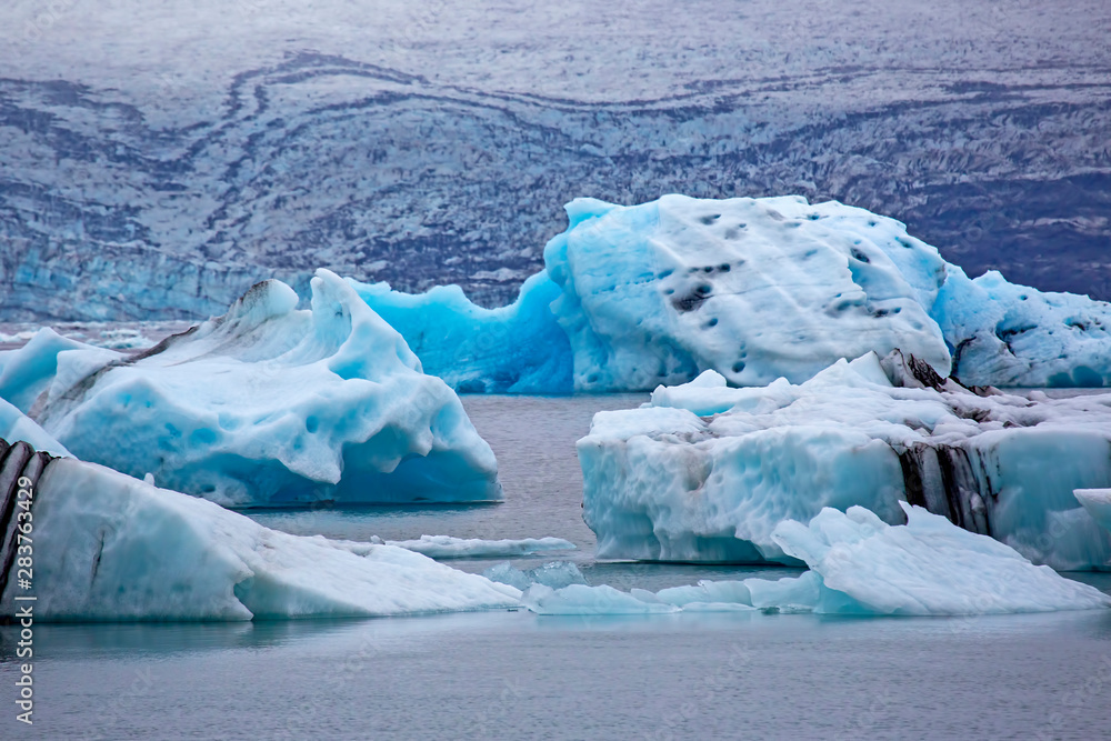 Blue Ice on the shore of the ice lagoon in Iceland