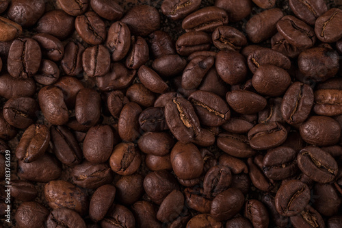 Coffee beans  on stone background. Top view with copy space for your text. Roasted coffee beans background. Beans texture  macro