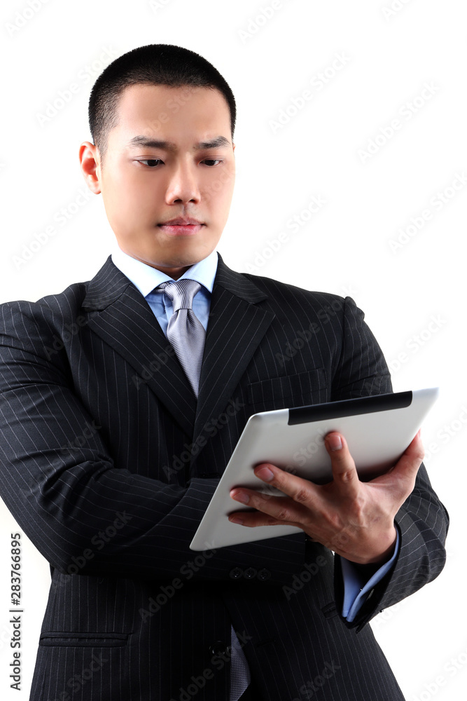 Businessman working on digital tablet Businessman working on digital tablet