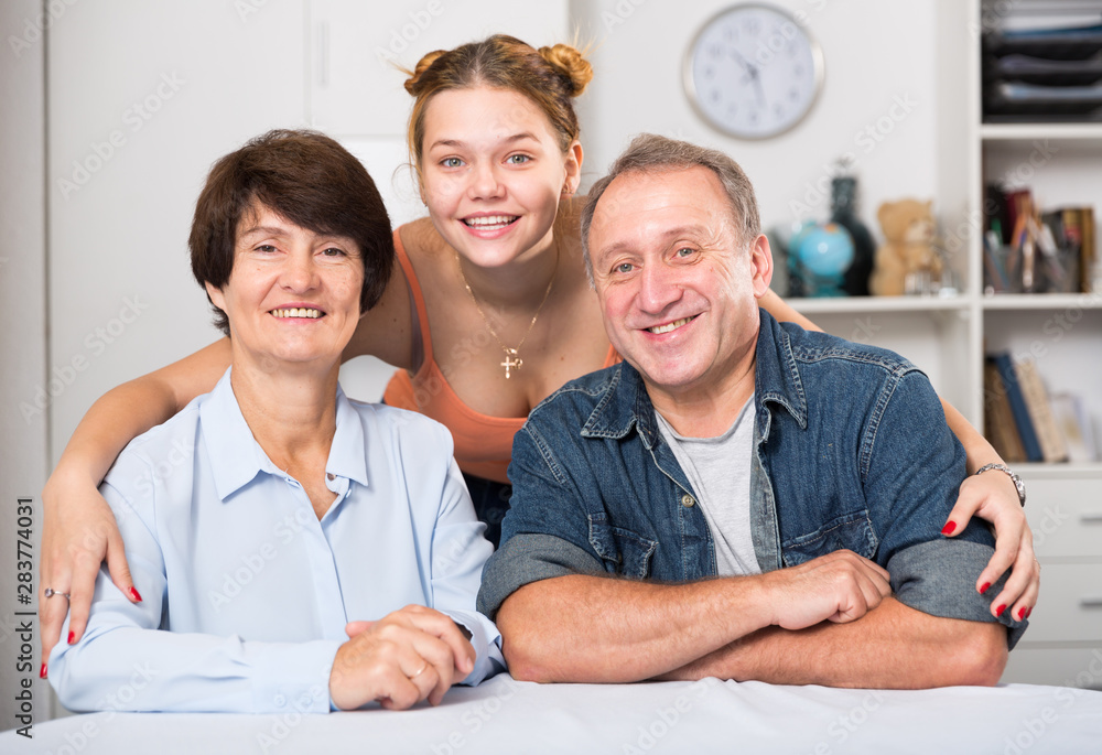 Fototapeta premium Portrait of happy family at the table