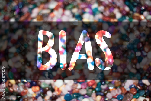 Text sign showing Bias. Conceptual photo Unfair Subjective One-sidedness Preconception Inequality Bigotry Blurry candies candy ideas message reflection sweets thoughts communicate photo