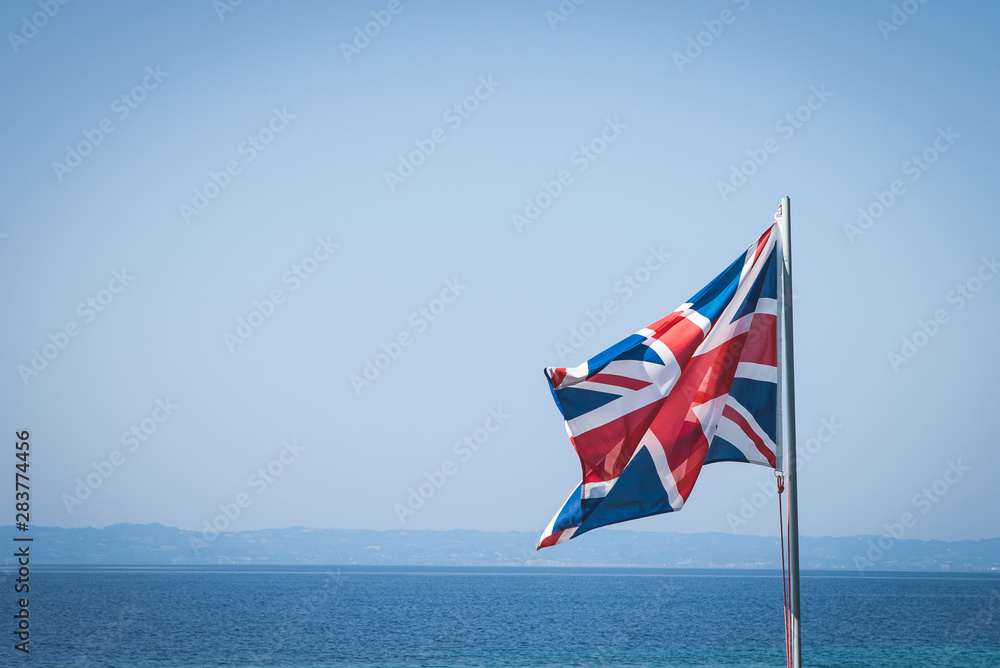 Fototapeta premium National flag of Great Britain at sea