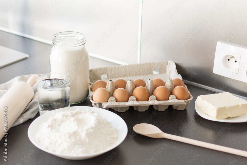 Food ingredients for baking: flour, eggs, milk, sugar. Process of baking. Food ingredients for baking: flour, eggs, milk, sugar. Process of baking.