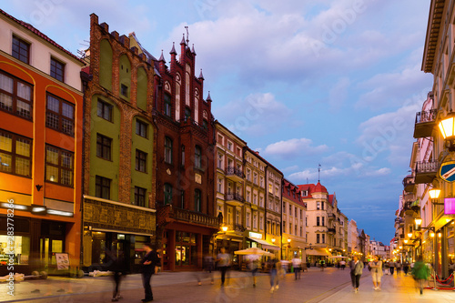 Night view of Torun streets and building illuminated at dusk