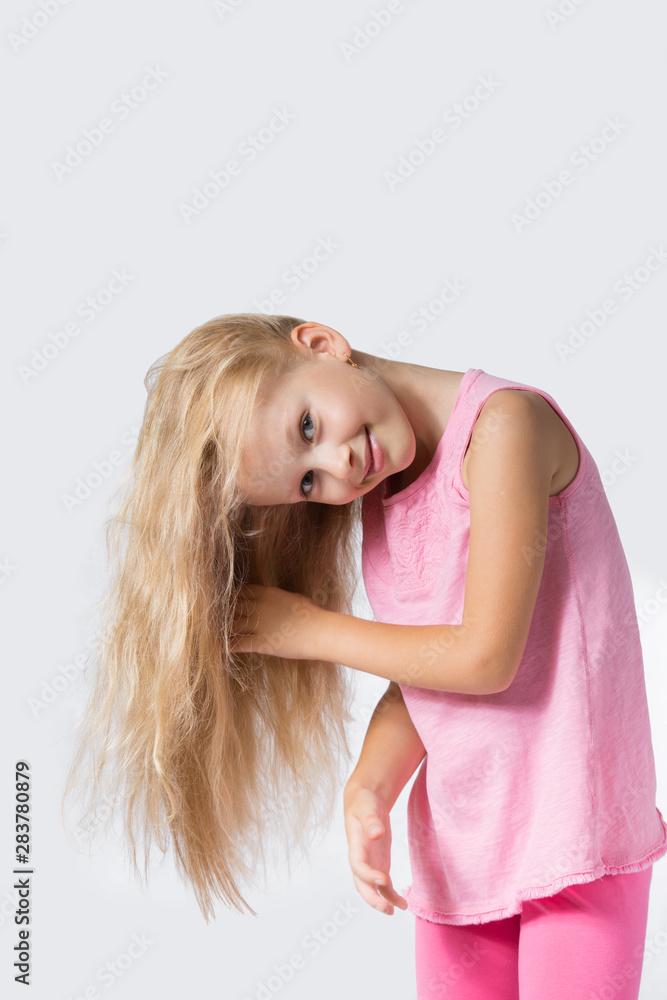 Little girl posing. Child girl shows hair. Little girl posing. Child girl shows hair.