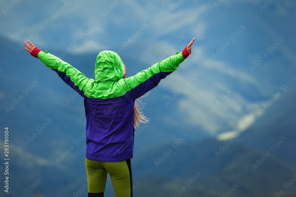 © Андрей Репетий - Young woman happiness and feeling freedom  in mountains