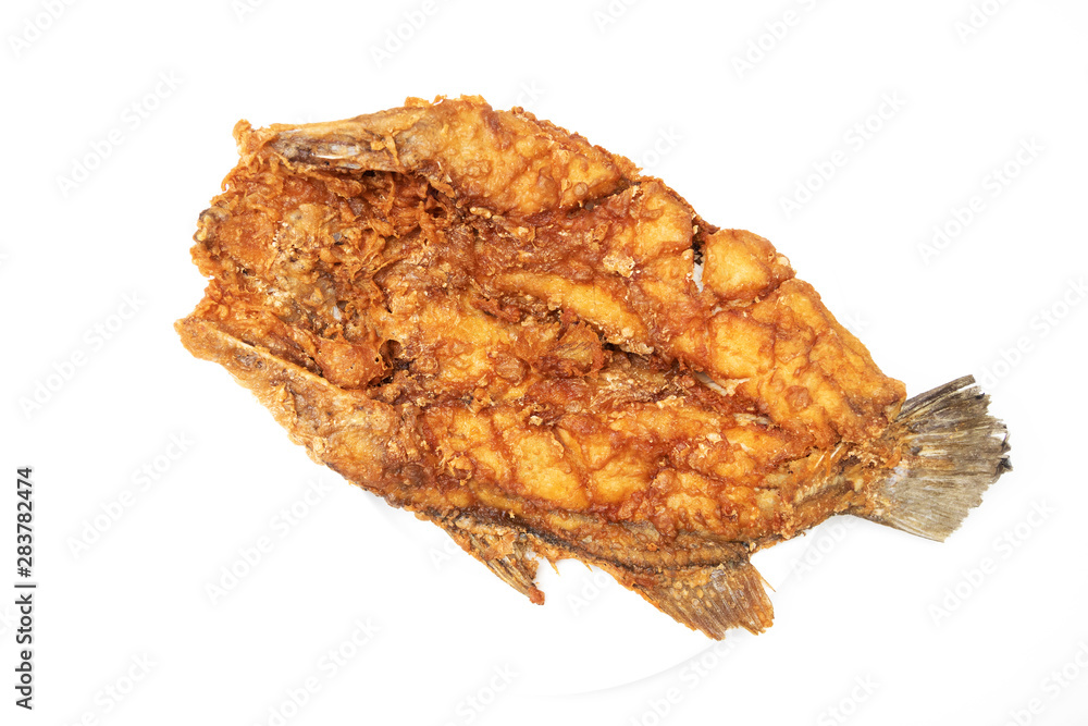 Deep fried sea bass with fish sauce and green mango chili fish sauce, based on chili fish sauce, addition of shredded green mango and lime juice isolated on white background.