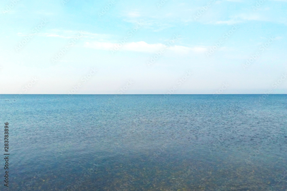 Sea landscape with sea horizon clear blue sky background