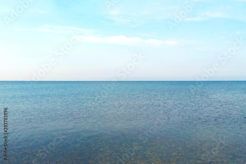 Sea landscape with sea horizon clear blue sky background