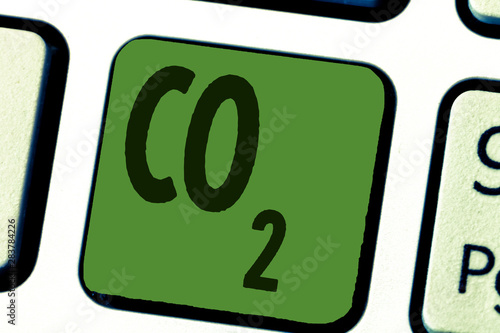 Conceptual hand writing showing Co2. Business photo text Noncombustible greenhouse gas that contributes to global warming. photo