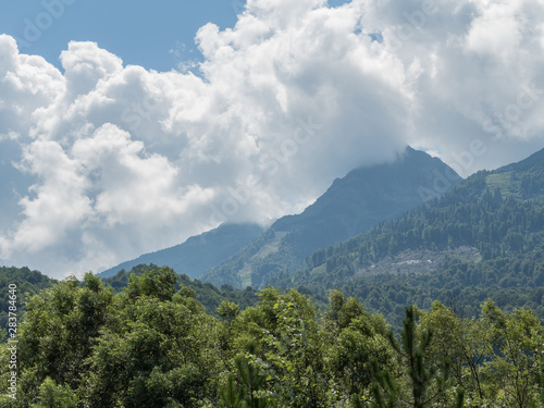 Beautiful mountains in clouds in the red meadow of Sochi