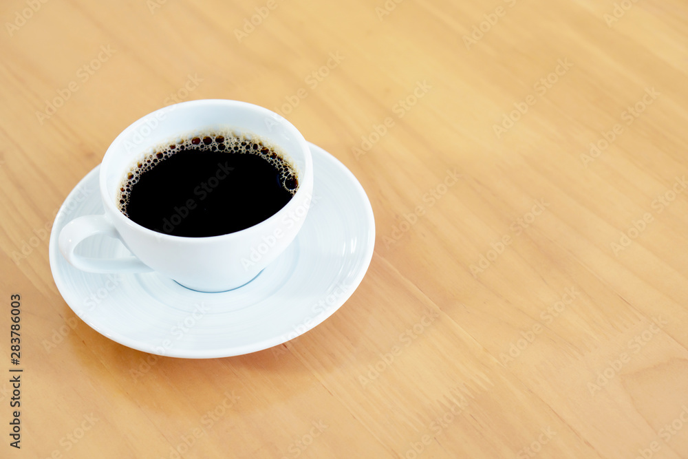 Cup of coffee on weathered dark table Cup of coffee on weathered dark table