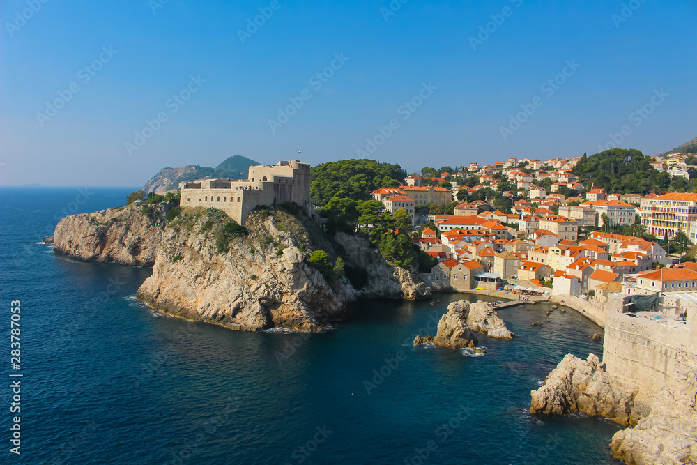 View of Dubrovnik and it's city wall from the Adriatic Sea with Fort Lovrijenac