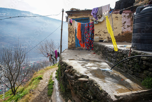 View on the house and clothes are dried on a rope near Kullu, Himachal Pradesh 