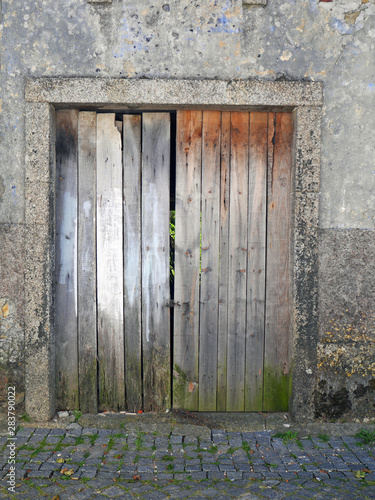 old wooden door in the wall © karolinaklink