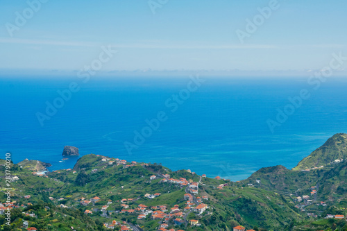 Fototapeta Naklejka Na Ścianę i Meble -  Viewpoint Portela, view to Atlantic ocean in summer sunny day near Machico and Porto da Cruz, Madeira island, Portugal