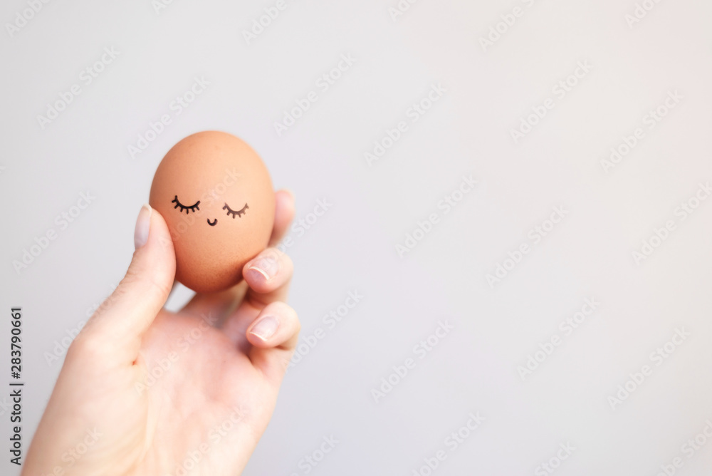 Woman holding egg with happy, funny and beautiful face. Woman holding egg with happy, funny and beautiful face.