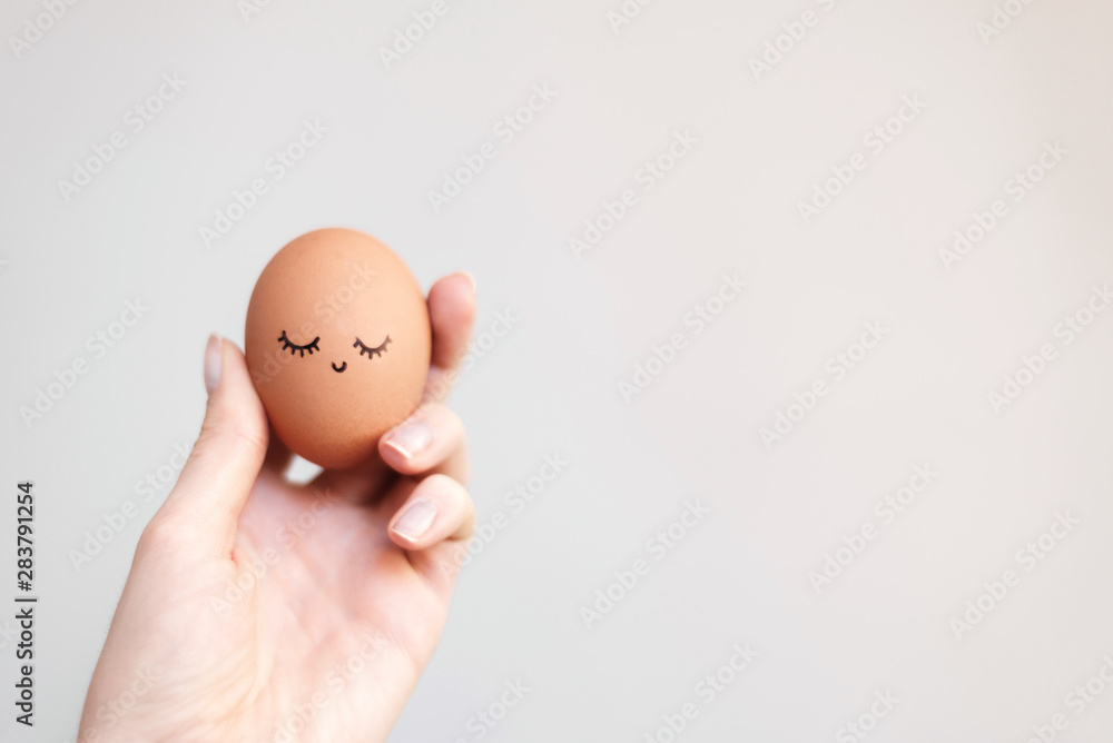 Woman holding egg with happy, funny and beautiful face. Woman holding egg with happy, funny and beautiful face.