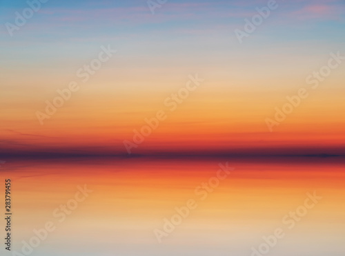 Fototapeta Naklejka Na Ścianę i Meble -  Vibrant and long exposure sunset background