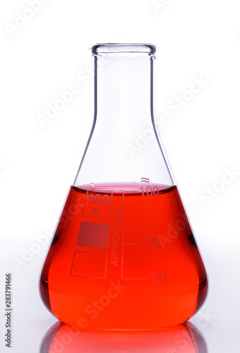 Scientific laboratory glass with red chemical liquid