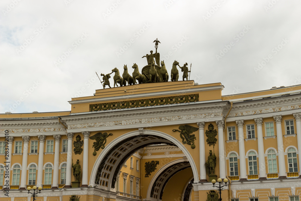 Decorated facade Triumphal arch of the General Staff Building in St. Petersburg, Russia in overcast day. View from the Palace Square. Built in 1819-1829.