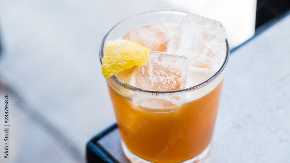 Cocktail with lemon peel Cocktail with lemon peel