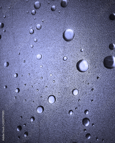 Light shines through a plastic shower door with a bubble-effect surface
