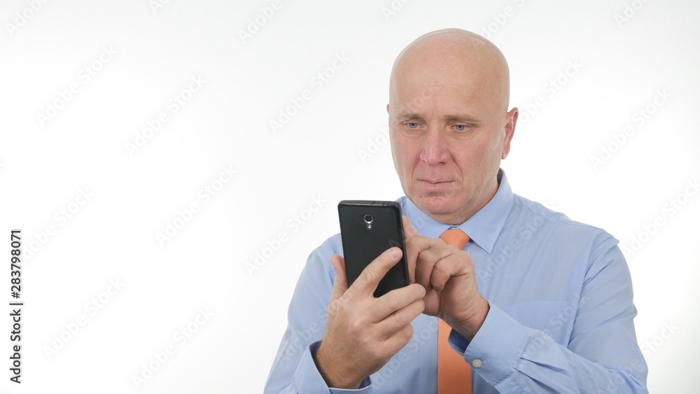 Confident Businessman Image Reading Message Using a Cellphone Confident Businessman Image Reading Message Using a Cellphone
