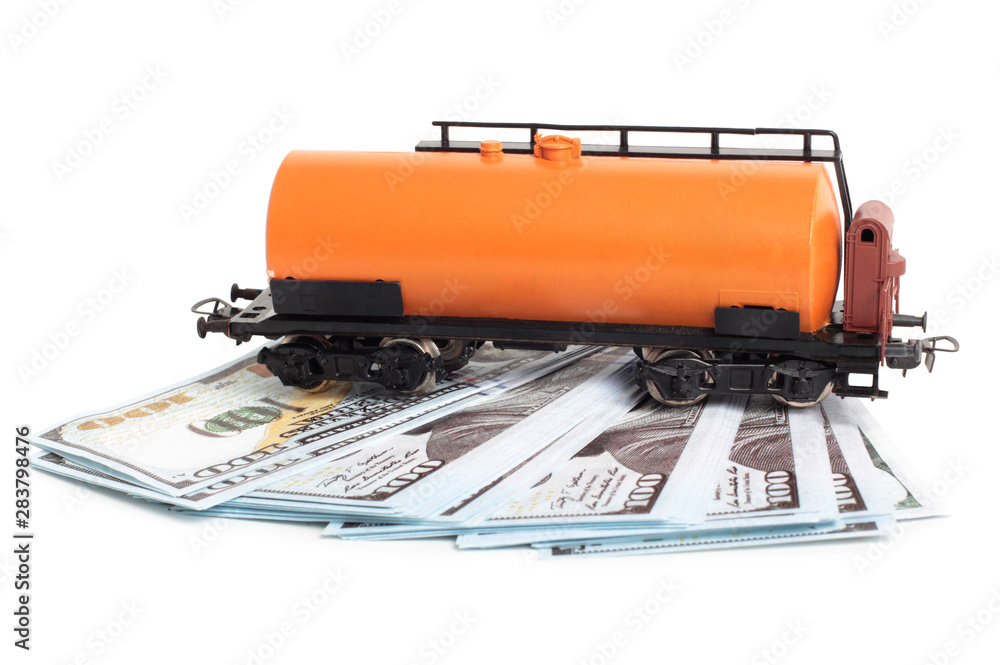 Oil tank and paper dollars on a white background Oil tank and paper dollars on a white background