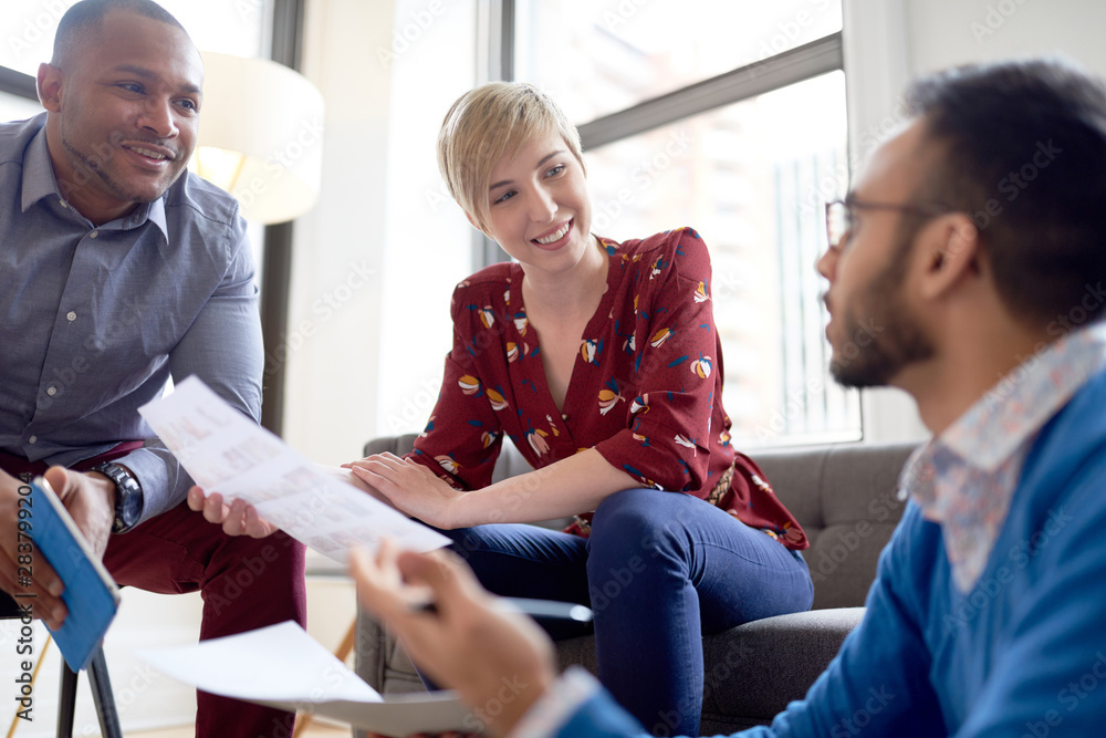 Fototapeta premium Multi-ethnic team of creative millenials collaborating on a brainstorm project