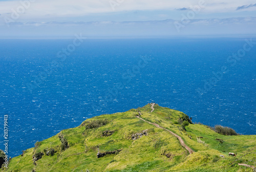 The viewpoint near the Chapel of Nossa Senhora da Boa Morte near Atlantic ocean in summer with blue skyline in Madeira, Portugal 