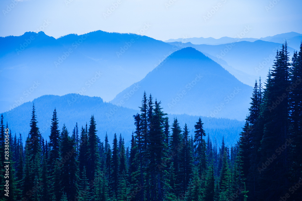 Hazy scenic view of mountain ranges in Mt. Rainier National Park.