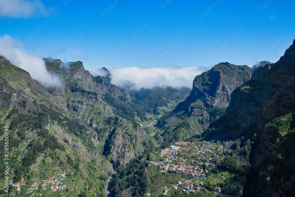 Panoramic mountains view from Eira do Serrado viewpoint down to Curral das Freiras through the Nun's Valley on Madeira Island