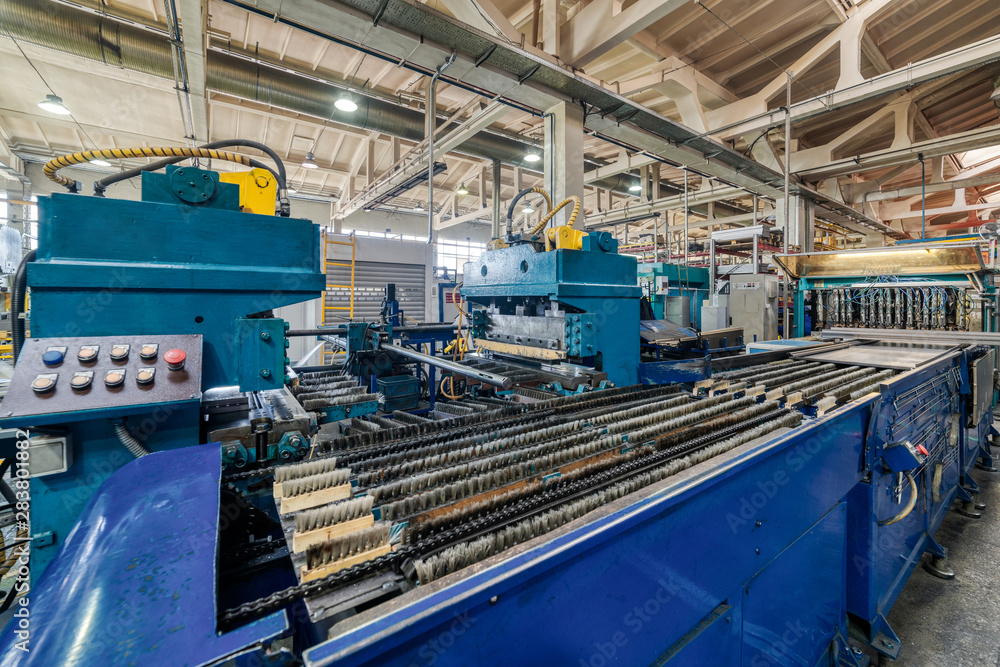 Roller forming machine. The interior of the plant producing a metal profile.