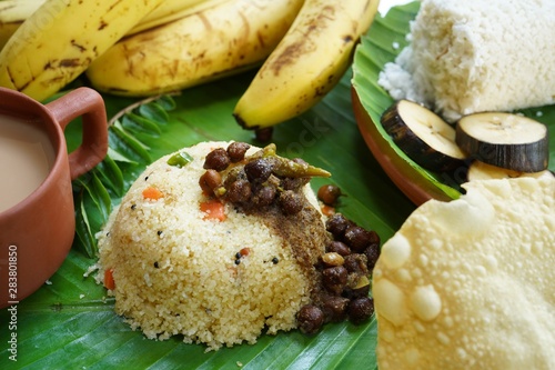 Rva Upma/Uppuma served with black Channa or Kadala curry banana and tea photo