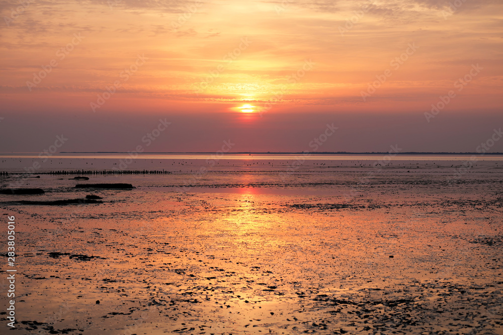 Sunset over the wadden sea and the german island spiekeroog - Stockphoto Sunset over the wadden sea and the german island spiekeroog - Stockphoto
