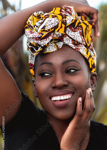 Close of smiling woman wearing head wrap